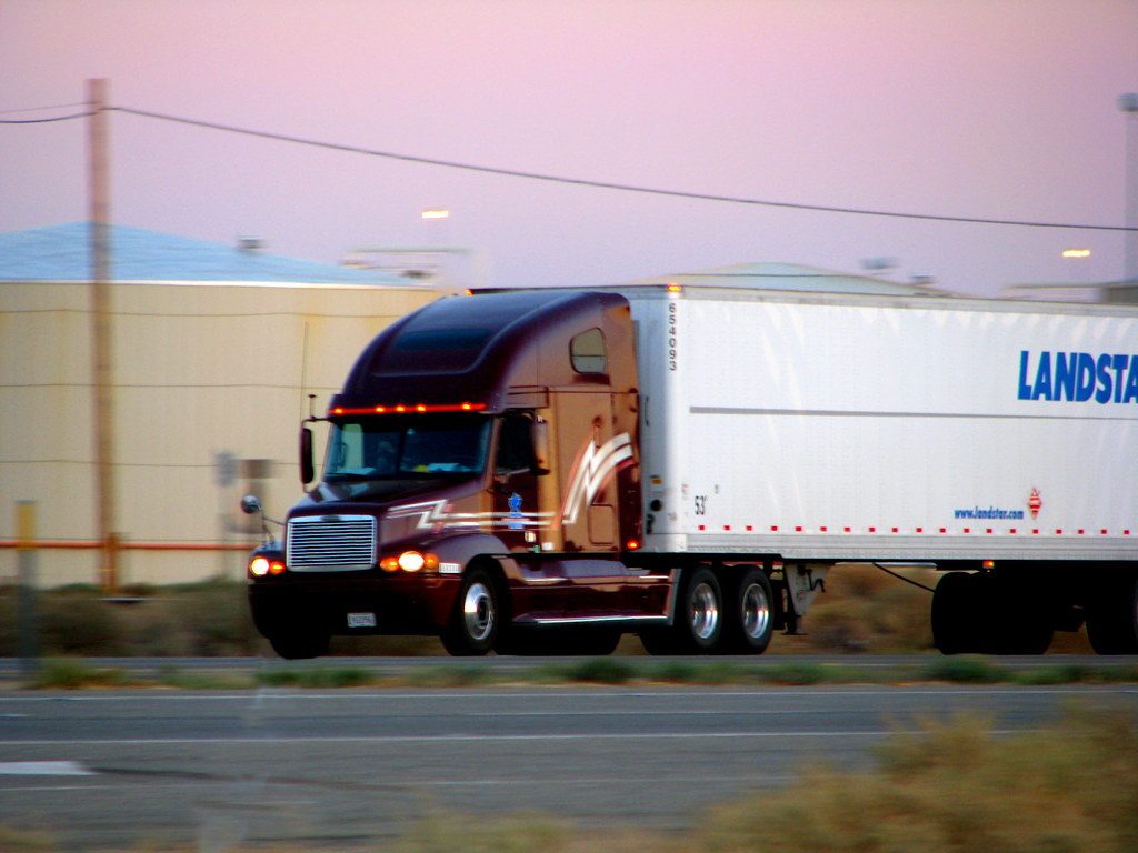 Illustrative photograph of burgundy Semi Truck
